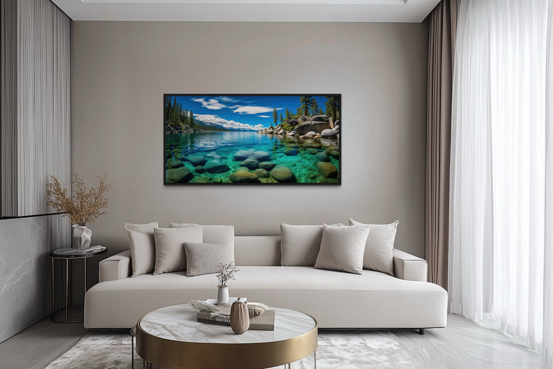 Framed canvas print of Lake Tahoe's Sand Harbor landscape hanging above a modern sofa.