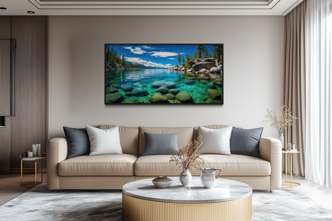 Framed canvas print of Lake Tahoe's Sand Harbor landscape hanging above a modern beige sofa.