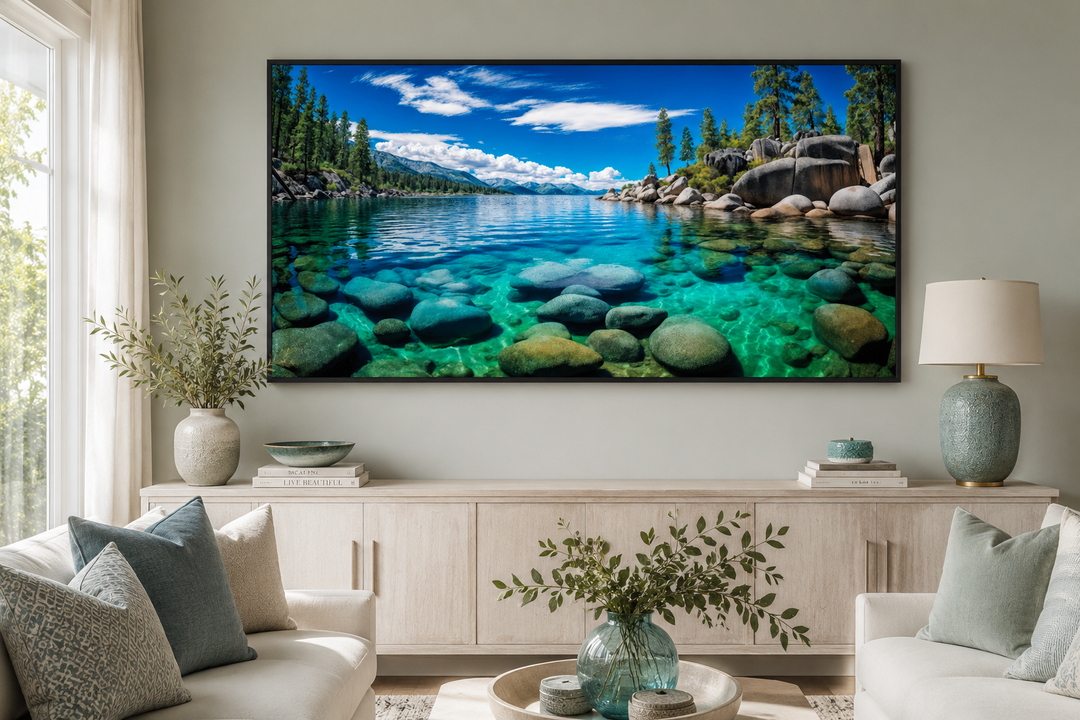 Framed canvas print of Lake Tahoe's Sand Harbor with clear blue water and rocks in a living room.