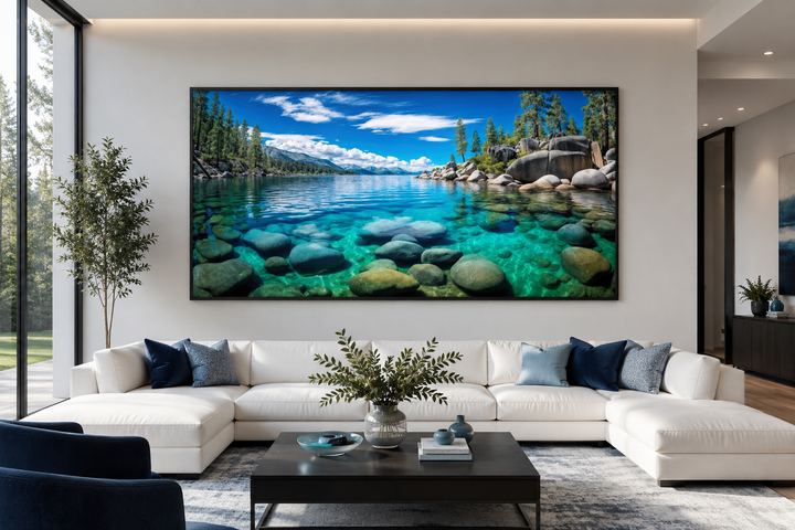 Framed canvas print of Lake Tahoe's Sand Harbor landscape above a white sectional sofa.