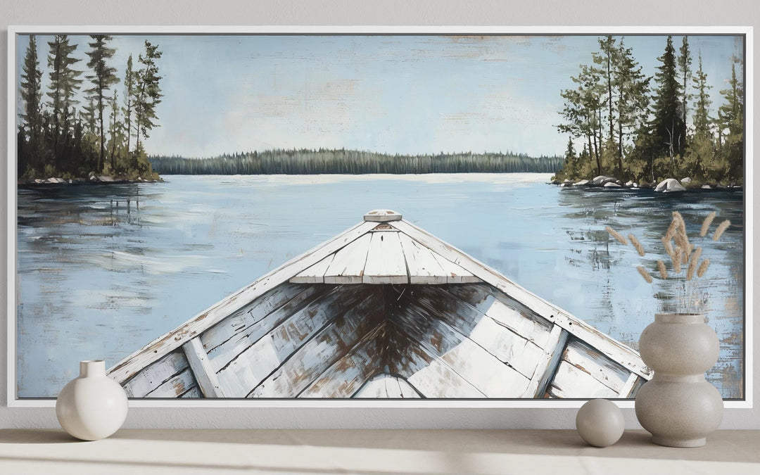 A rustic canvas painting of a white canoe on a calm blue lake surrounded by evergreen trees.