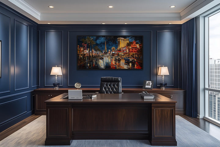 Las Vegas Strip At Night Framed Canvas Wall Art displayed in a dark blue paneled office.