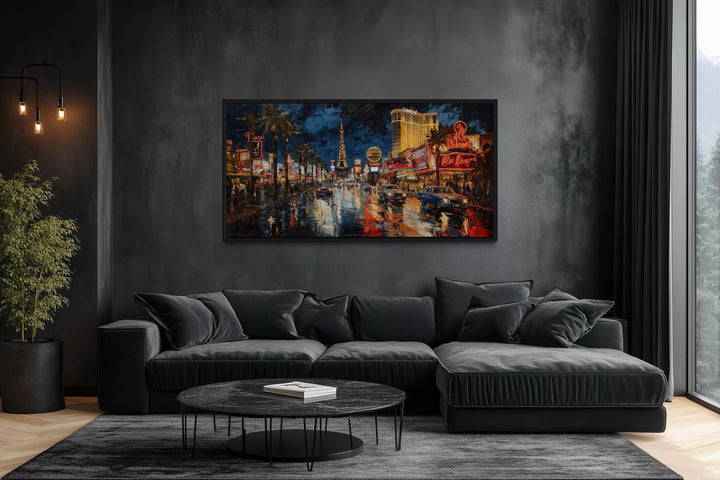 Las Vegas Strip At Night Framed Canvas Wall Art hanging in a dark, modern living room.