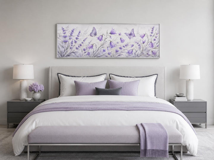 Long horizontal canvas art of lavender wildflowers and butterflies above a bed in a purple bedroom.