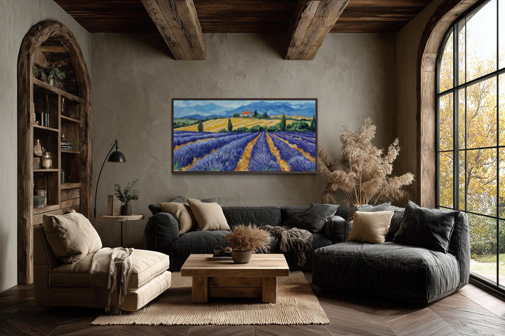 Panoramic lavender field canvas print in a rustic frame above a modern sofa in a cozy living room.
