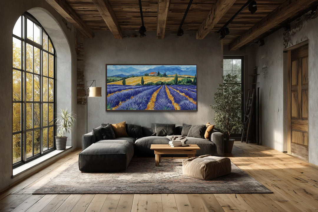 Panoramic lavender field canvas print in a rustic living room with wood beams and a large window.