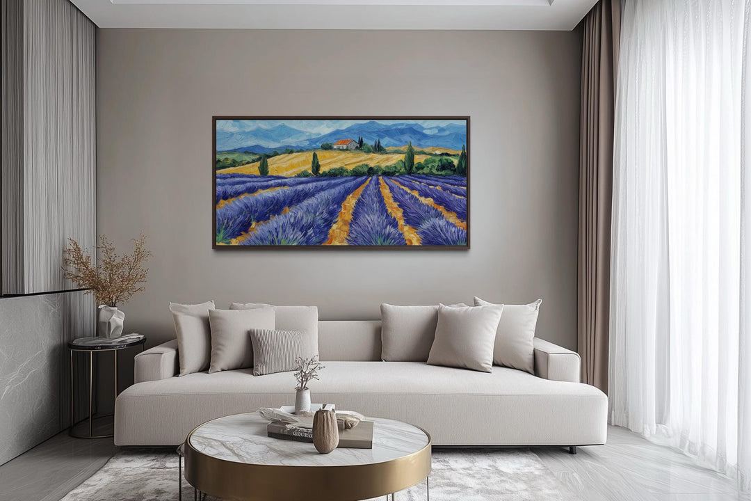 Panoramic lavender field canvas print in a rustic style hanging above a modern neutral sofa.