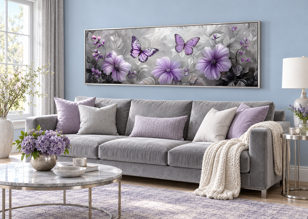 Horizontal wall art with purple flowers and butterflies above a gray sofa in a blue living room.