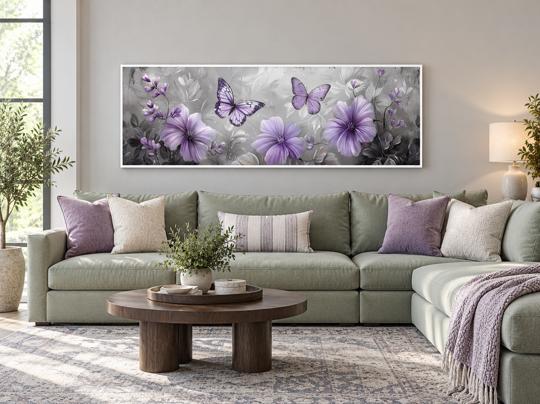 Horizontal wall art with lavender flowers and butterflies above a sage green sectional sofa.