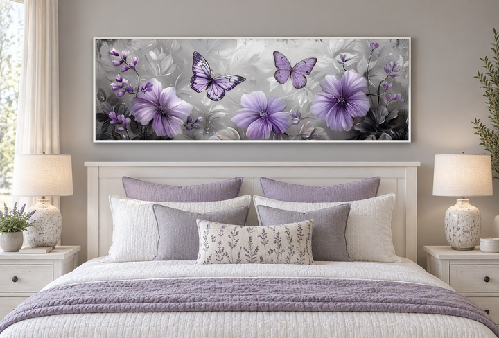Horizontal wall art with lavender flowers and butterflies above a bed in a neutral-toned bedroom.