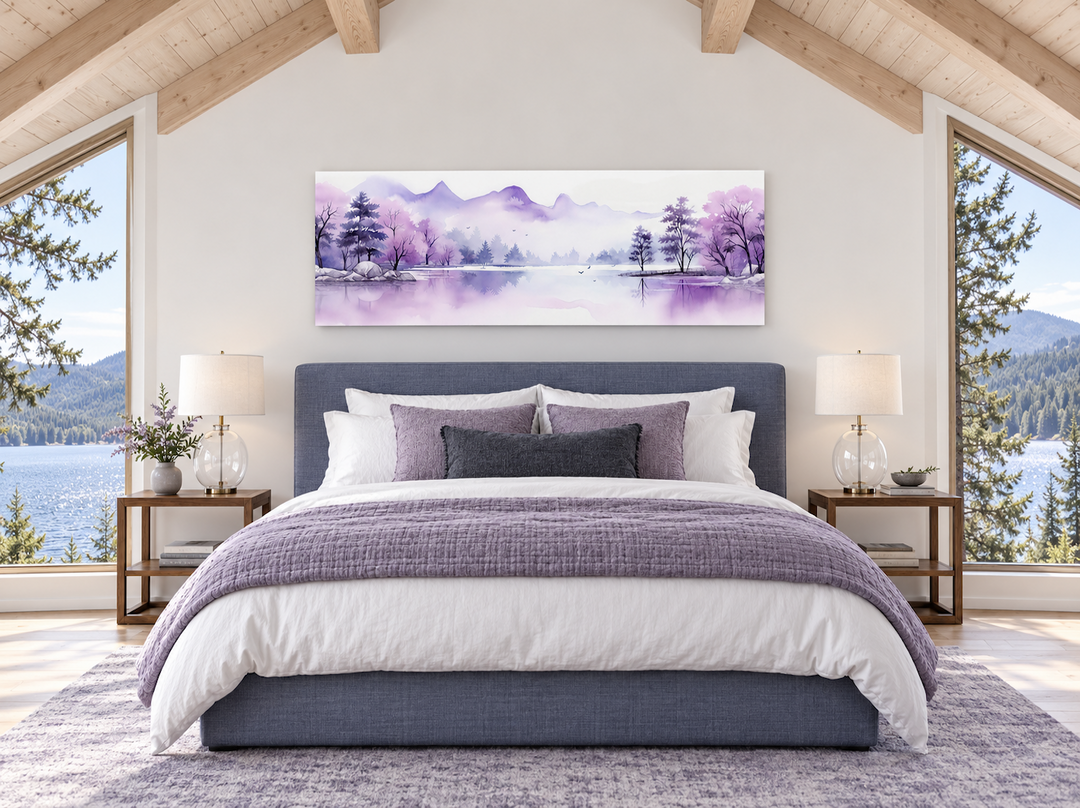 Purple mountains lake watercolor canvas print hanging above a bed in a modern bedroom.