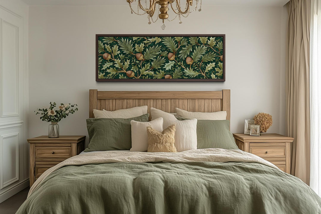 William Morris style horizontal canvas wall art with green leaves and acorns above a wooden bed.