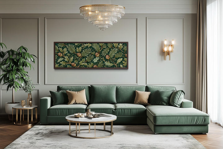 Long horizontal William Morris style canvas wall art with green oak leaves and acorns above a sofa.