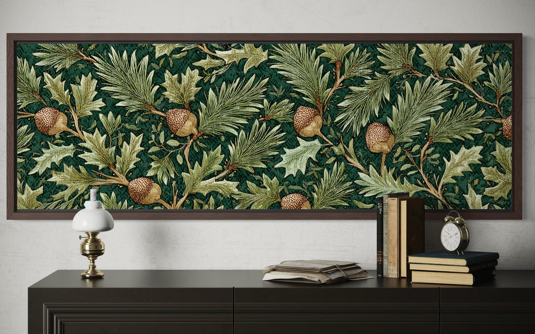 Long horizontal William Morris style wall art with green oak leaves and acorns above a dark console.