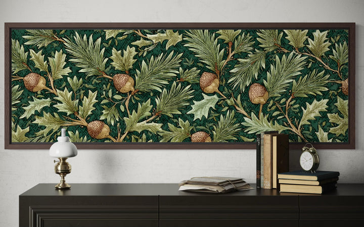 Long horizontal William Morris style wall art with green oak leaves and acorns above a dark console.