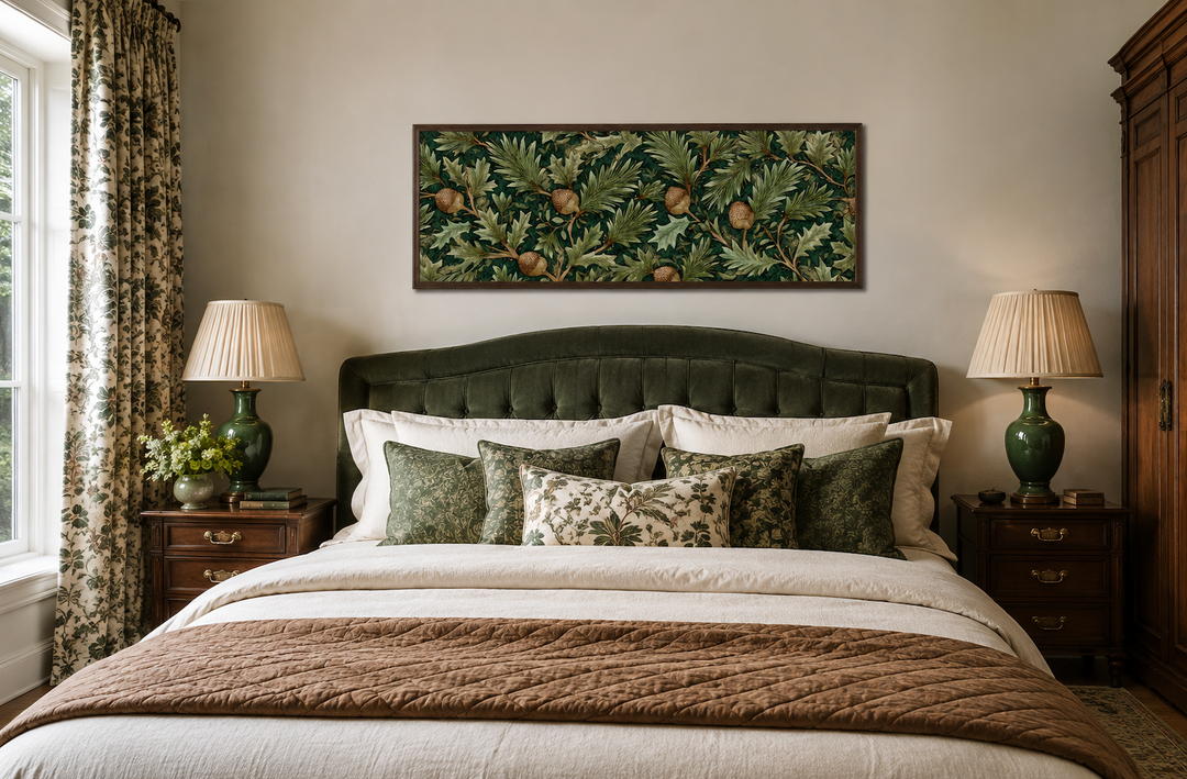 William Morris style horizontal wall art with green leaves and acorns above a green velvet bed.