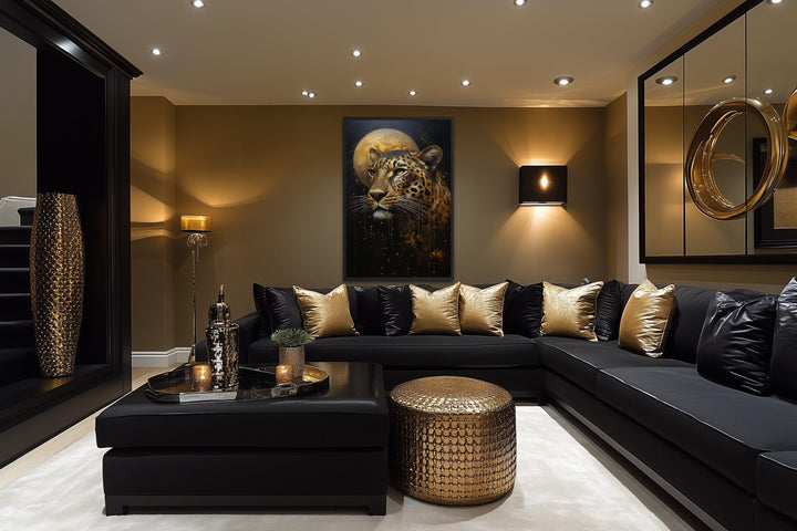 Vertical canvas print of a leopard and golden moon in a moody, black and gold living room.