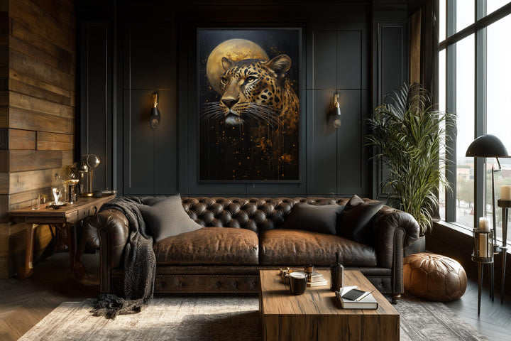 Vertical leopard and moon canvas print in a moody, dark-toned modern living room.