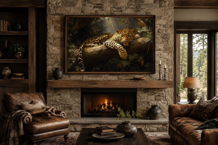 Framed canvas wall art of a leopard resting on a tree branch above a stone fireplace in a room.