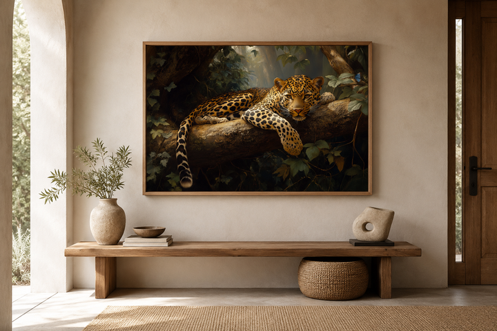 Framed canvas wall art of a leopard resting on a tree branch in a lush jungle setting.