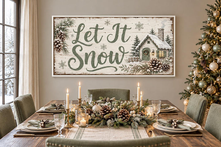 Let It Snow Sage Green Script and Snowy Cottage Framed Canvas Wall Art above a set dining table.