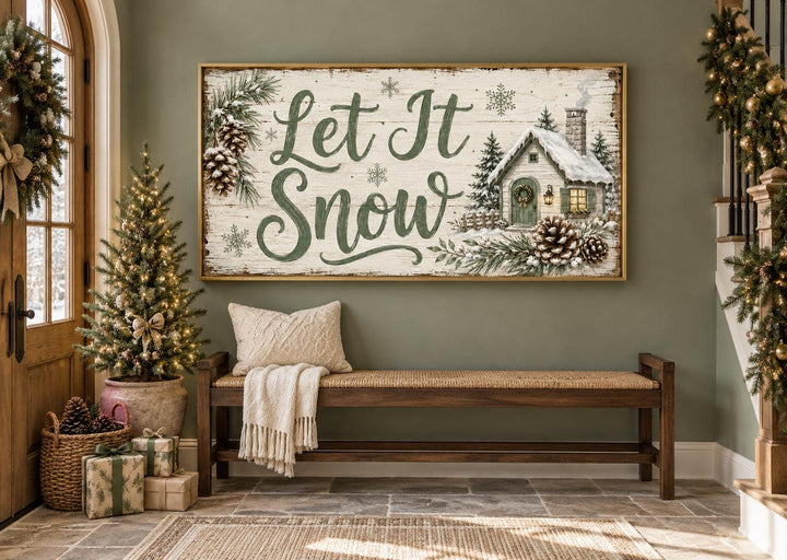 Let It Snow sage green script and snowy cottage framed canvas wall art in a winter entryway.