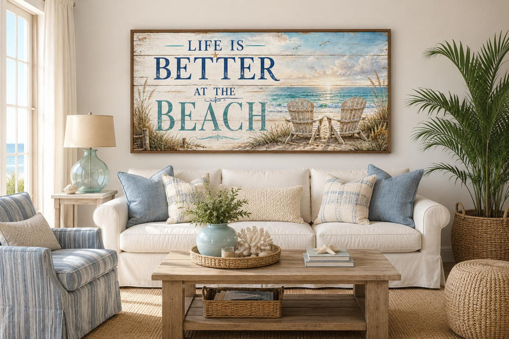 Life Is Better at the Beach canvas sign above a white sofa in a coastal living room.