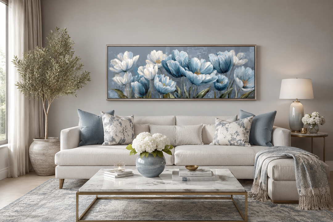 Light blue abstract floral horizontal wall art hanging above a white sofa in a modern living room.