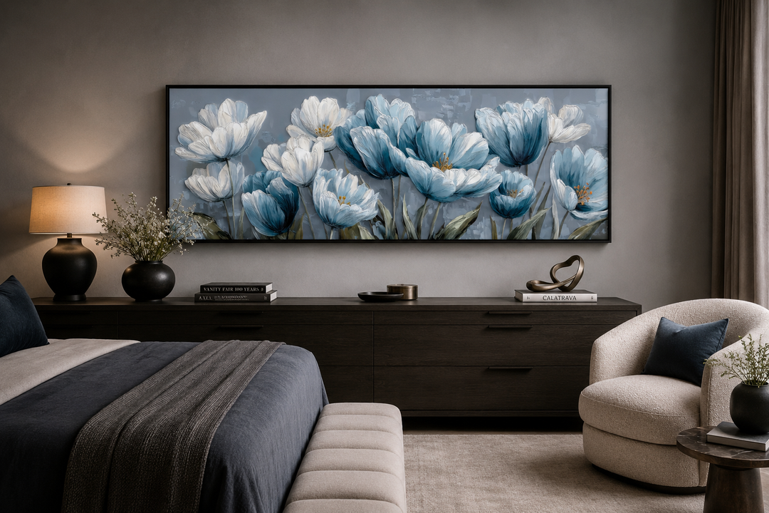 Light blue abstract floral horizontal wall art hanging above a dark wood dresser in a bedroom.