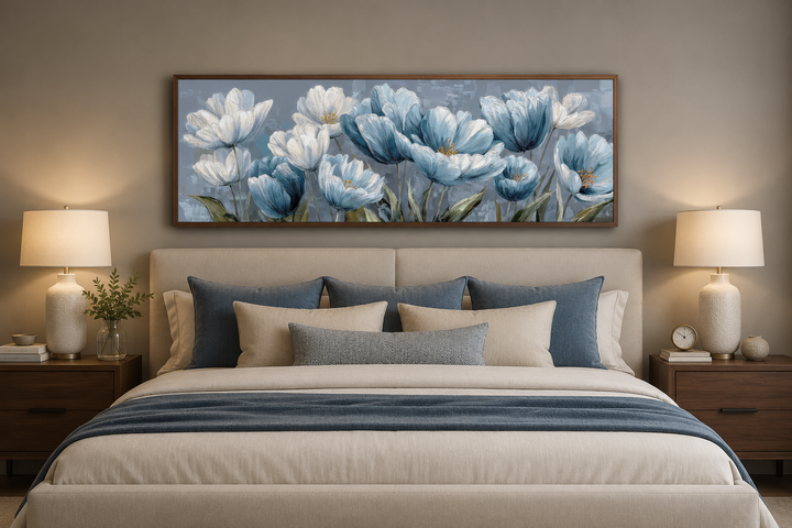 Light blue abstract floral horizontal wall art in a brown frame hanging above a beige bed.