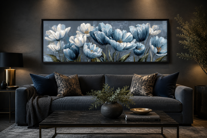 Light blue abstract floral wall art in a black frame above a dark gray sofa in a modern room.