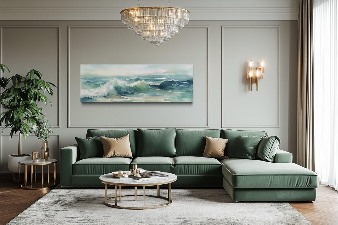 Light green ocean waves minimalist horizontal wall art above a green sofa in a modern living room.
