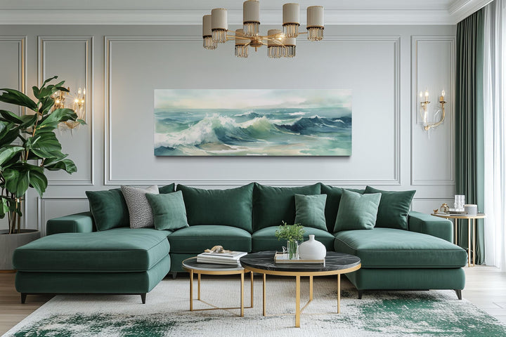 Light green ocean waves minimalist horizontal wall art hanging above a green sectional sofa.