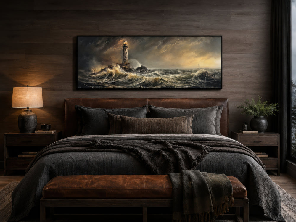 Panoramic nautical wall art of a lighthouse in a stormy sea above a leather headboard in a bedroom.