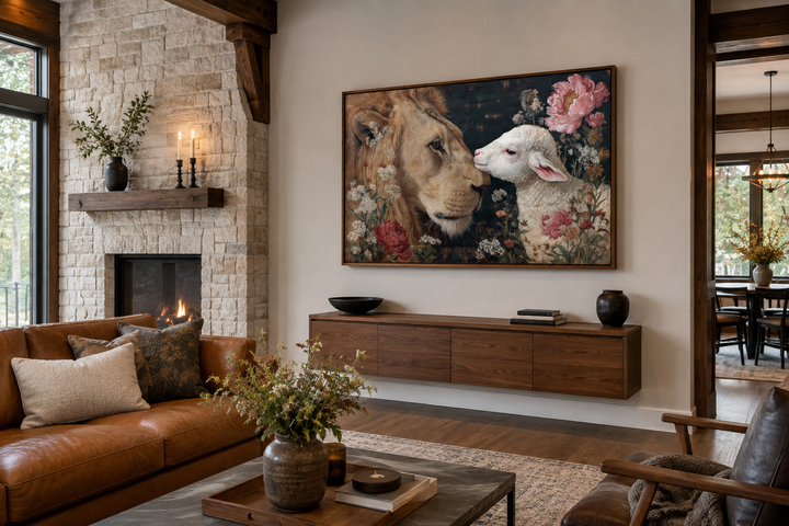Lion and Lamb framed canvas wall art hanging above a wooden console in a rustic living room.