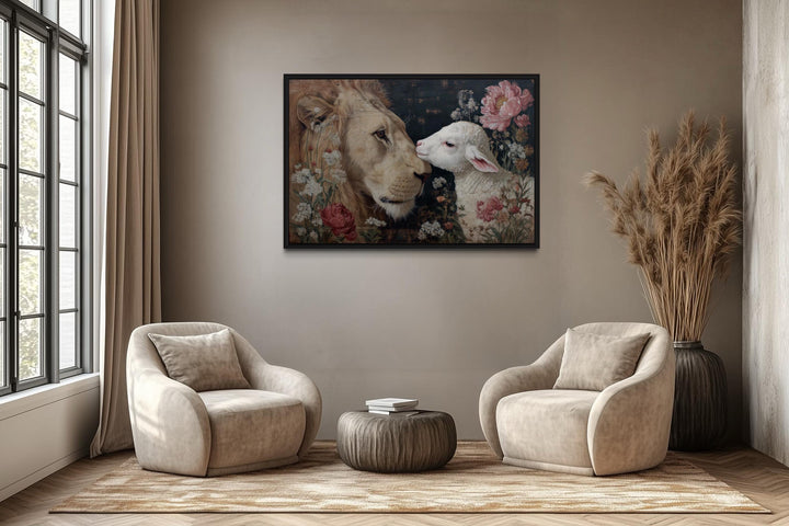 Lion and Lamb framed canvas wall art hanging above two armchairs in a modern living room.