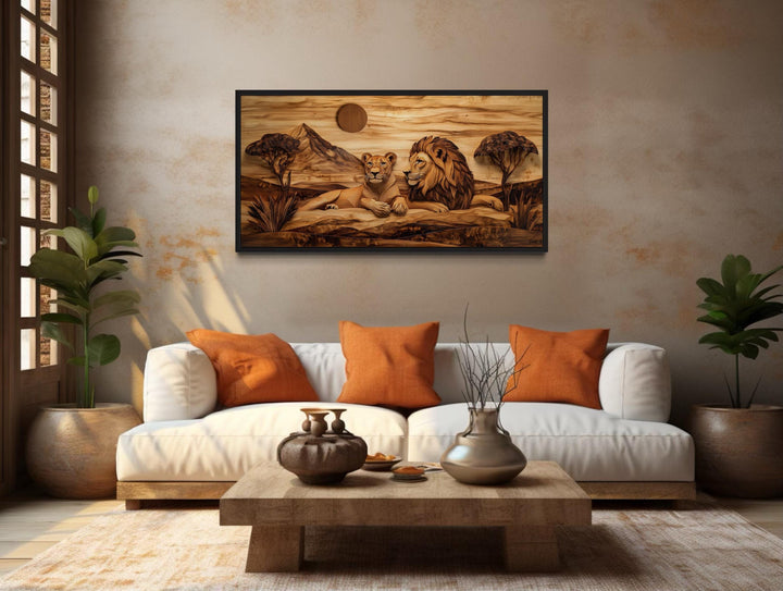 Lion and lioness wood texture canvas print hanging above a white sofa in a rustic living room.