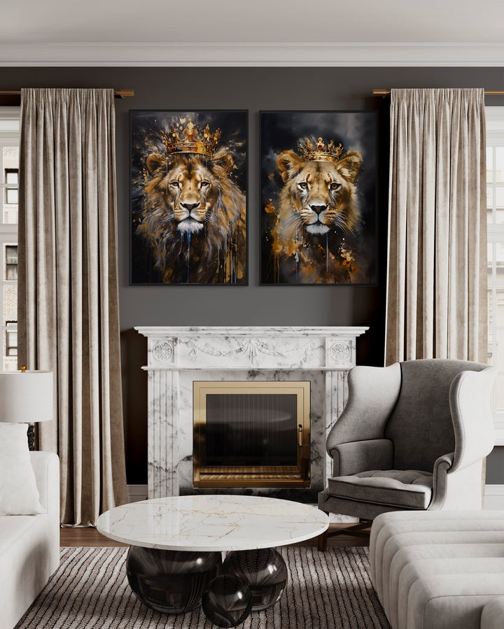 Two framed canvas prints of a lion and lioness wearing gold crowns above a marble fireplace.