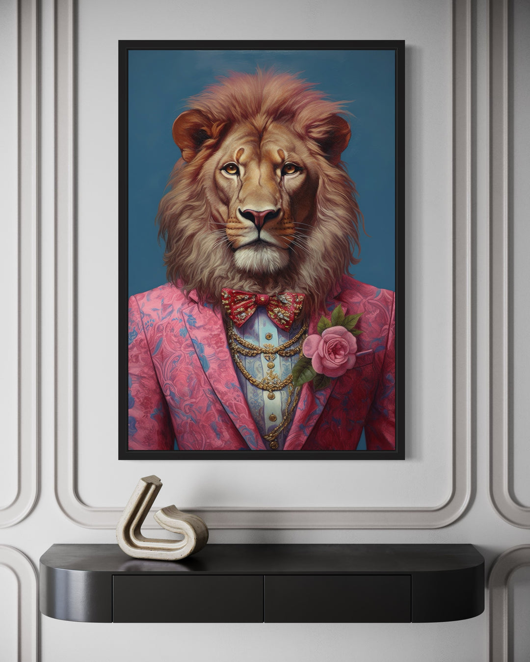 Lion in a pink suit maximalist framed canvas wall art hanging above a black console table.