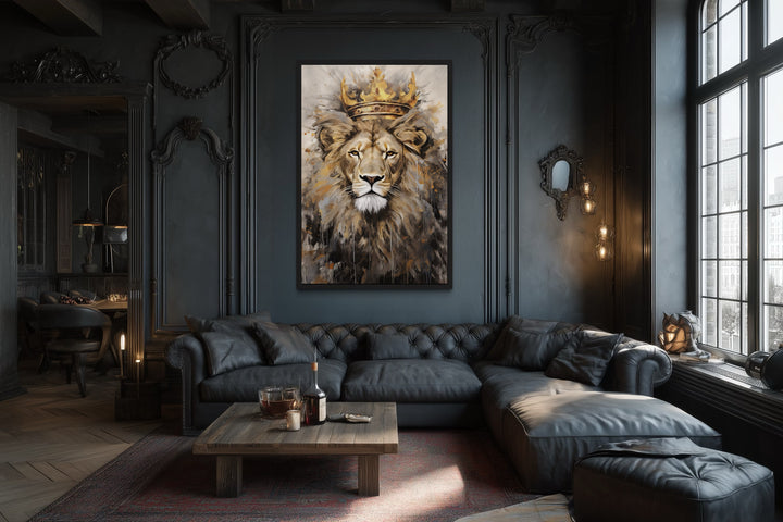Framed canvas wall art of a lion wearing a gold crown in a dark, moody living room setting.