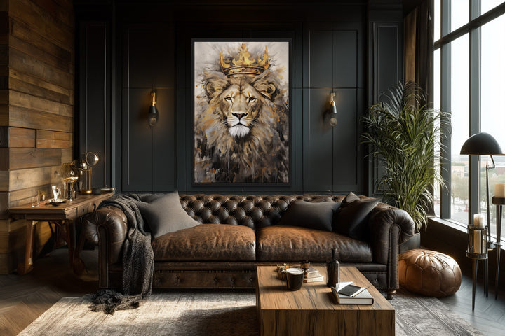 Lion King with crown framed canvas wall art hanging above a leather sofa in a dark, modern room.