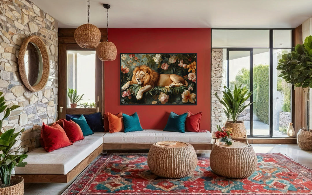 Lion sleeping in the jungle framed canvas wall art hanging on a red wall in a living room.