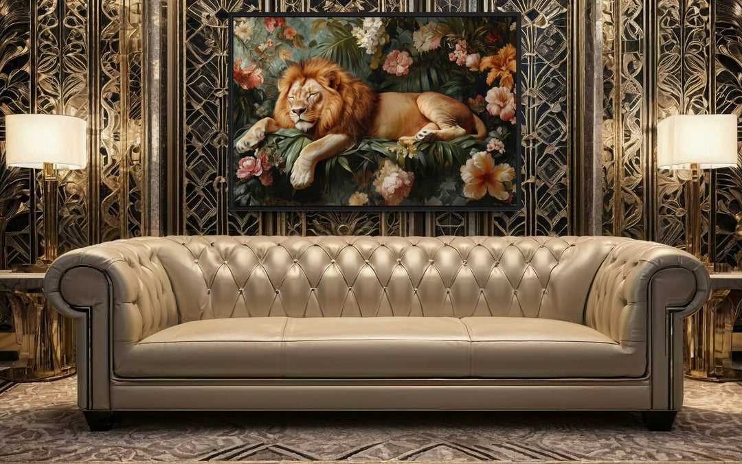 Framed canvas wall art of a lion sleeping in a jungle above a tufted sofa in a modern living room.