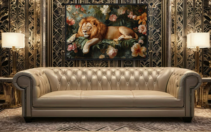 Framed canvas wall art of a lion sleeping in a jungle above a tufted sofa in a modern living room.