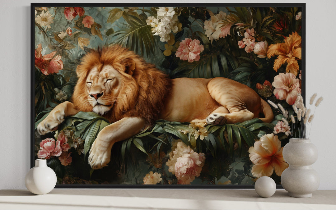 Framed canvas wall art of a lion sleeping among lush jungle flowers and greenery.