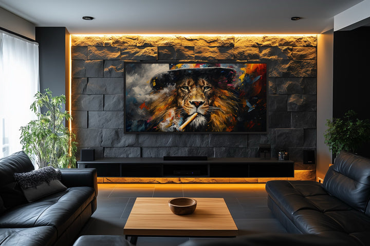 Framed canvas print of a lion smoking a cigar, mounted on a stone wall in a modern living room.