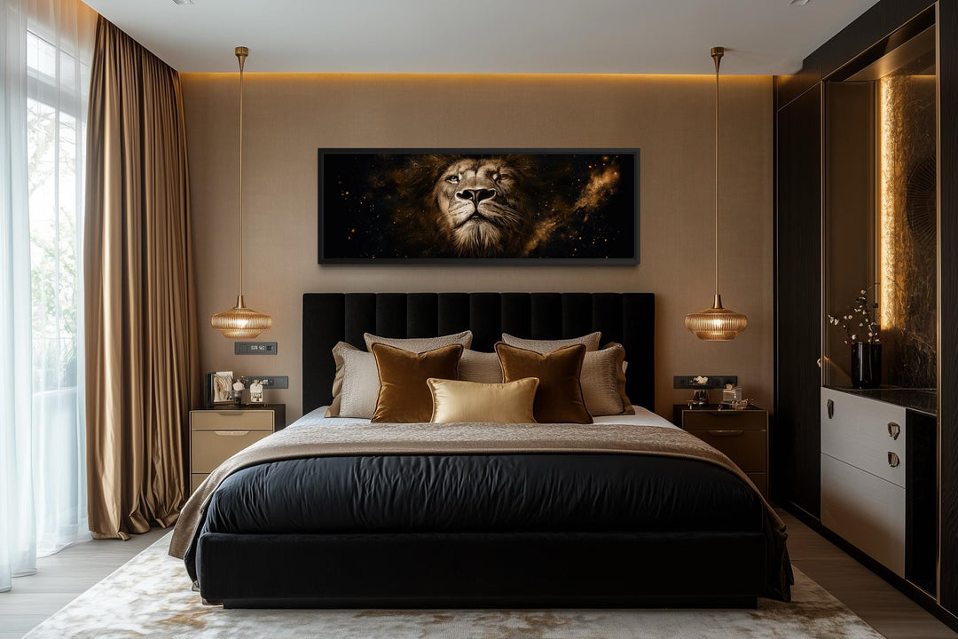 A long narrow canvas print of a majestic lion's face in black and gold above a modern bed.