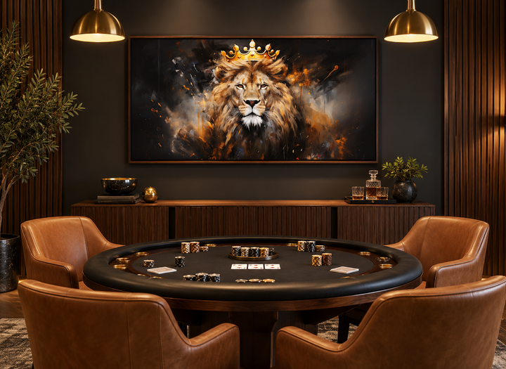 Regal lion canvas print with a gold crown displayed above a poker table in a modern game room.