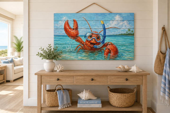 A whimsical lobster in snorkeling gear is printed on a distressed wood panel in a coastal room.