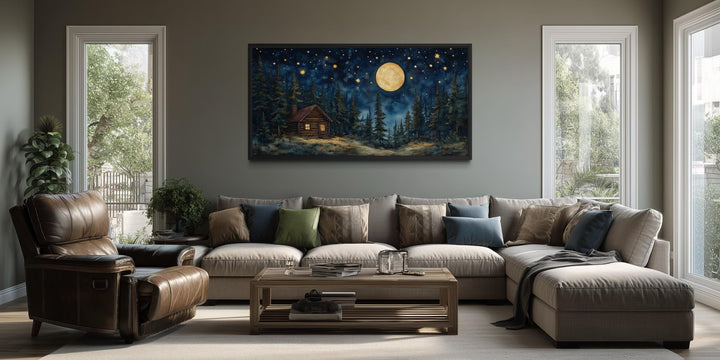 Log Cabin in the Moonlit Woods canvas wall art hanging in a modern living room.